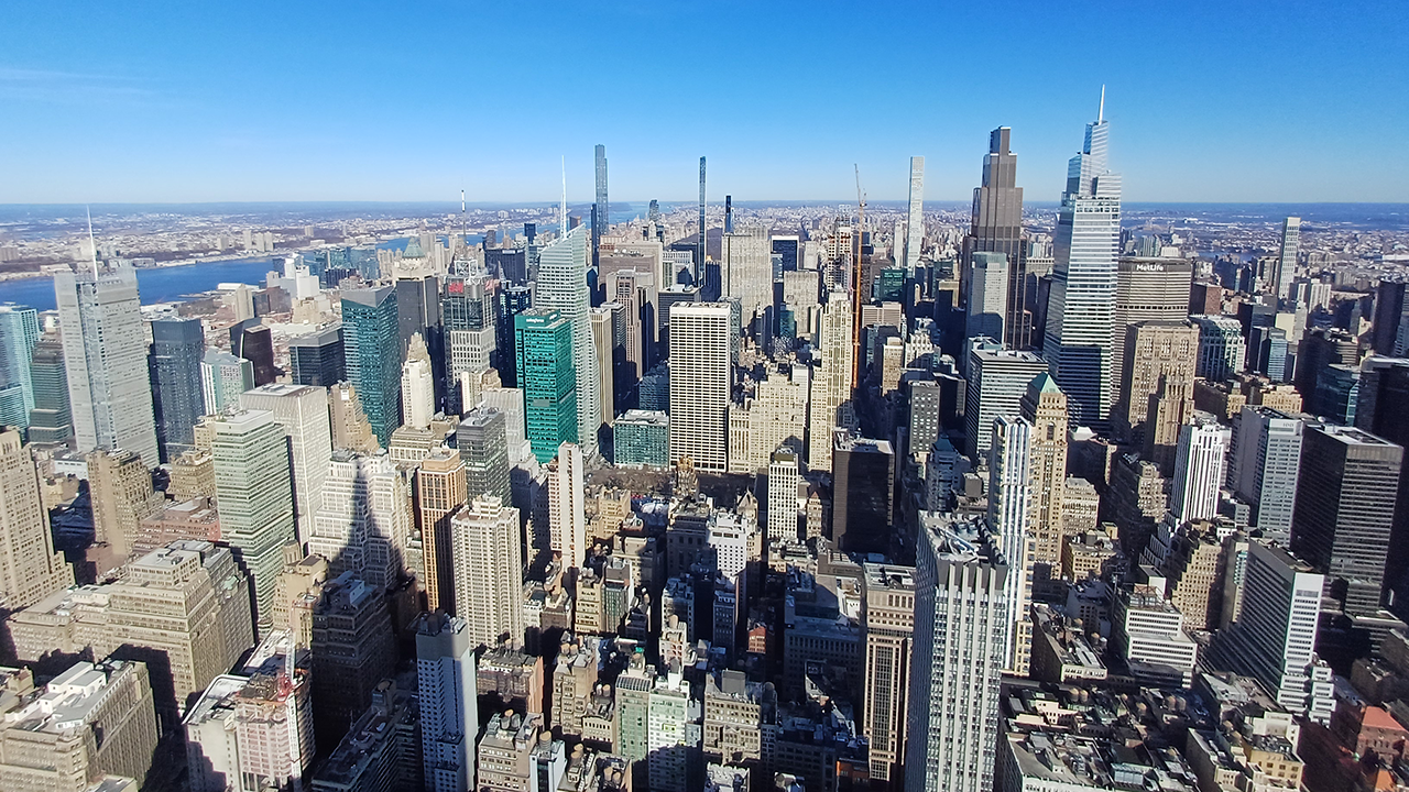 Aerial view of Manhattan's midtown skyline on a clear day.